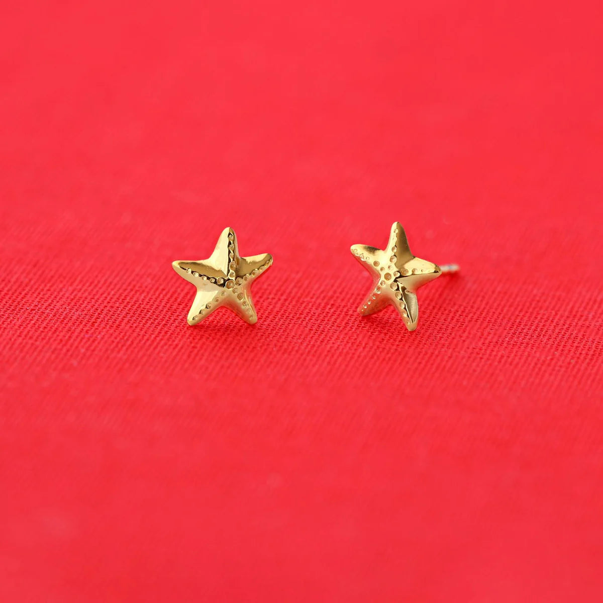 Kris Nations - Gold starfish stud earrings